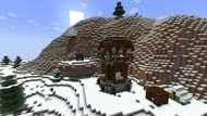 A pillager hut with a nearby igloo (Image via Mojang)